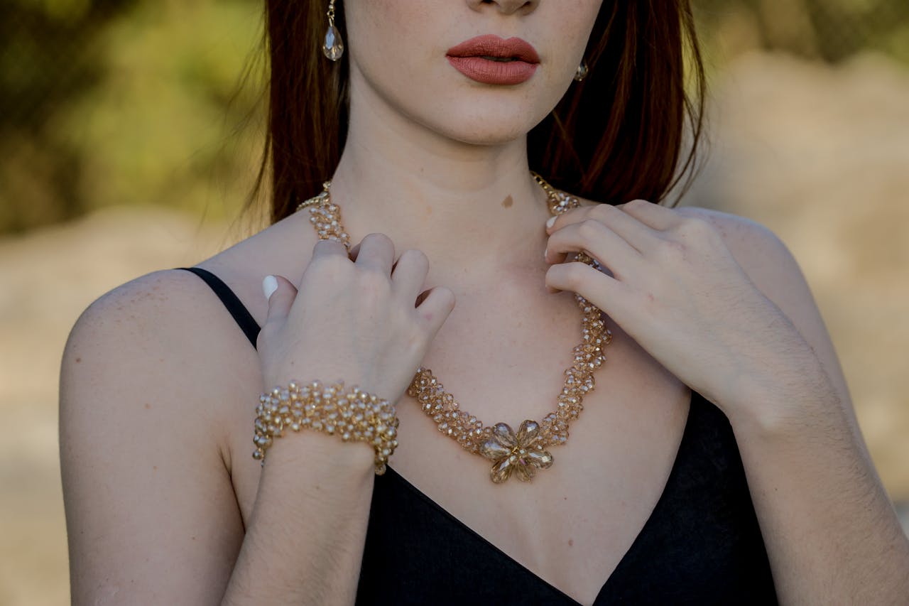 our-services-3 Stylish portrait featuring woman with pearl jewelry including necklace and earrings.